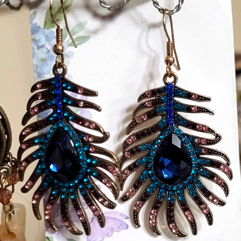 Eye Candy Blue and Pink Feather Earrings with Intricate Design